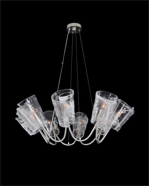 This eight-light chandelier in an antique silver-leaf finish features blown glass shades
